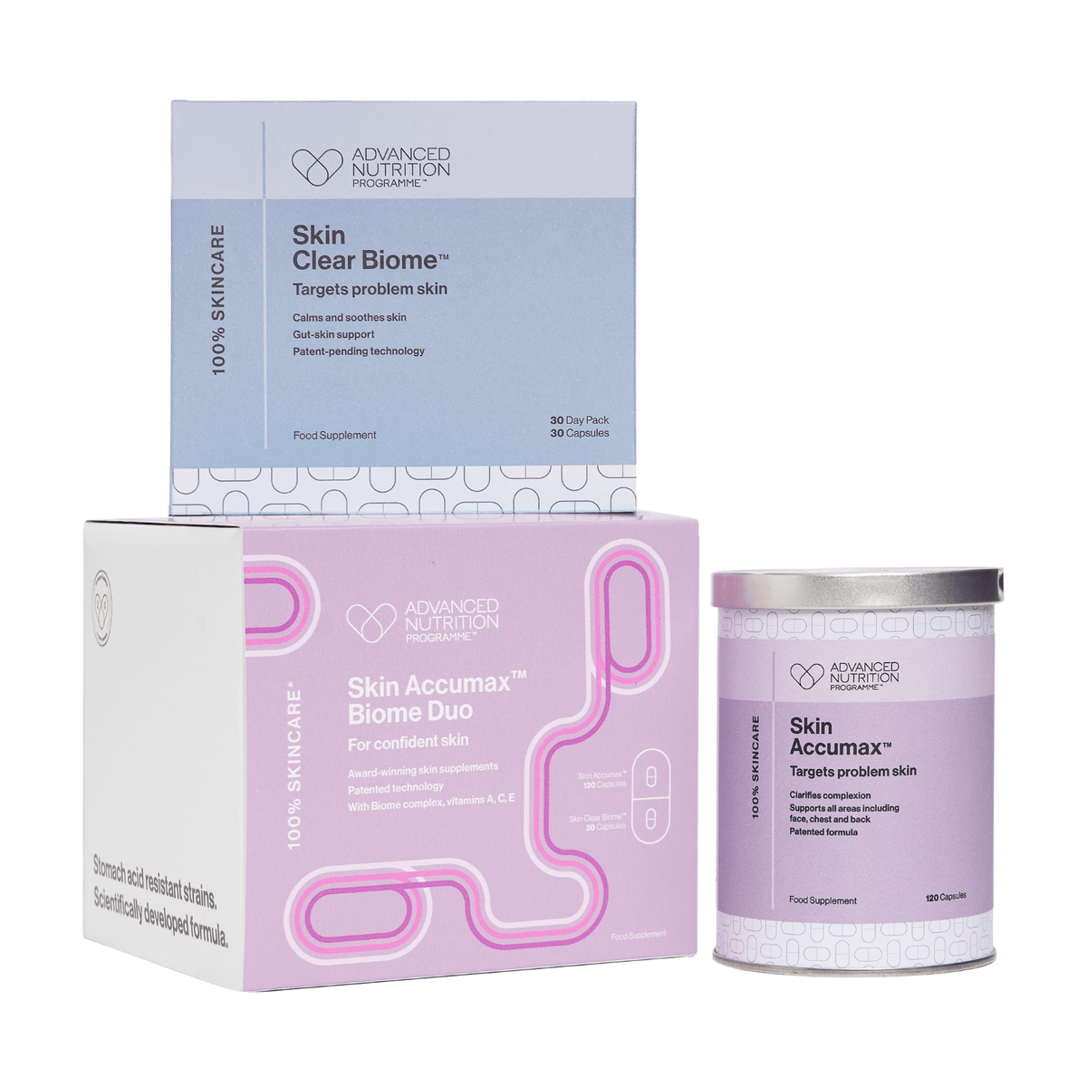 Advanced Nutrition Programme Skin Accumax Biome Duo gift box in white and pink, shown with a lilac Skin Accumax tin and a pale blue Skin Clear Biome box on a white background.