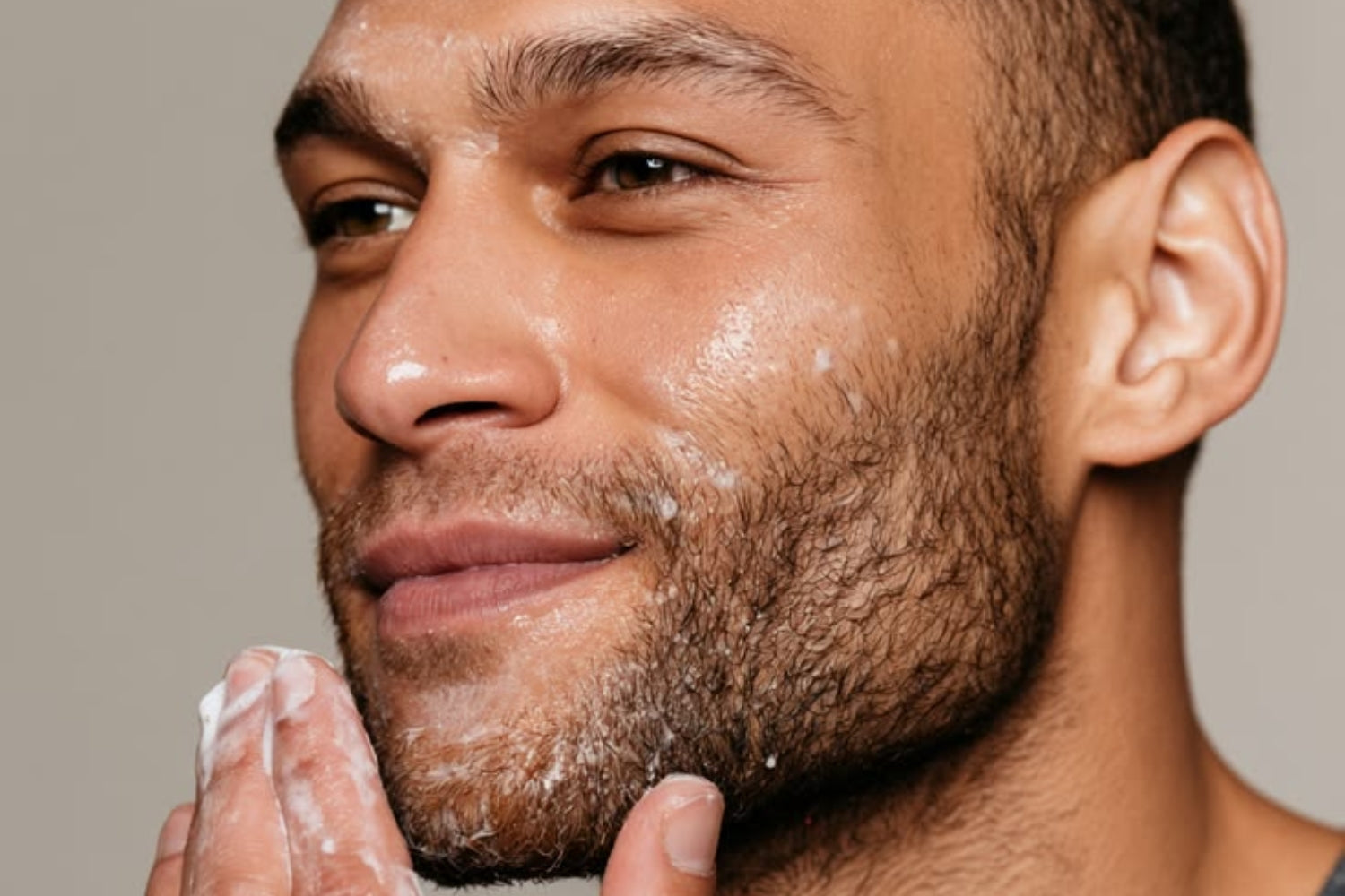A man s face close-up doing skincare